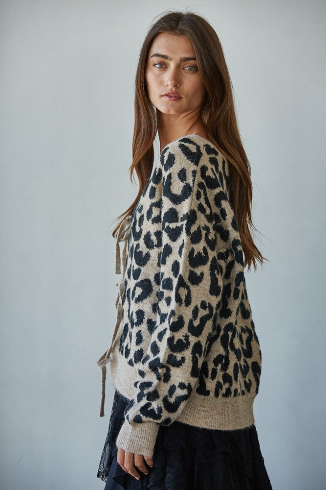 Side view of Feline Leopard Print Tie Cardigan in mocha black with tie-front design and long sleeves