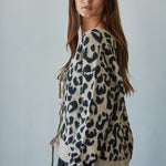 Side view of Feline Leopard Print Tie Cardigan in mocha black with tie-front design and long sleeves