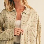 Close-up front view of the taupe floral cotton jacket showing print and button details