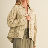 Front portrait of model wearing the Floral Back-Pleated Cotton Jacket in taupe