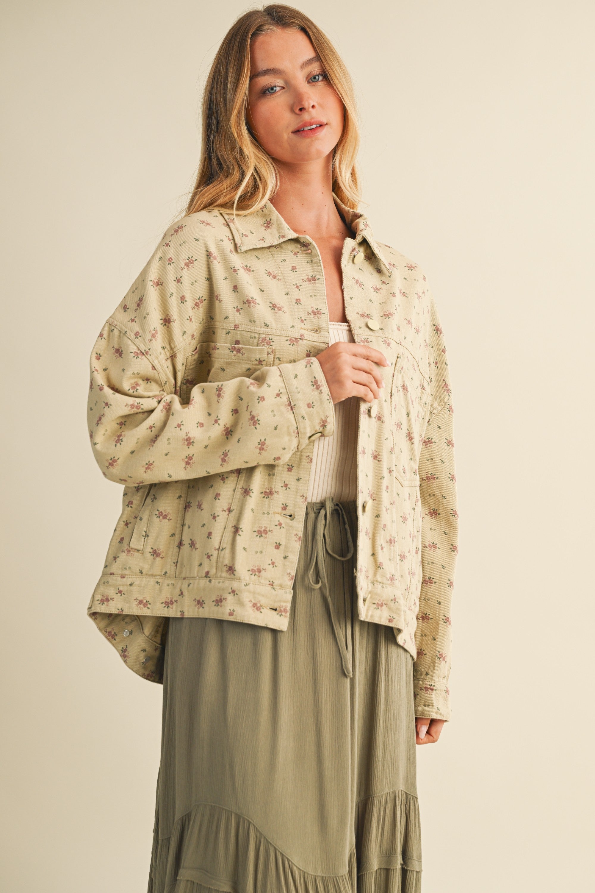 Front portrait of model wearing the Floral Back-Pleated Cotton Jacket in taupe