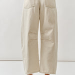 Beige wide-leg pants worn by a person on a white background