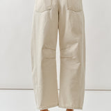Beige wide-leg pants worn by a person on a white background