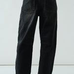Back view of the faded black barrel-leg jeans