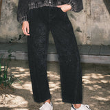 Front lifestyle view of model wearing Floral Embroidered Barrel Leg Jeans in faded black
