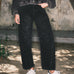 Front lifestyle view of model wearing Floral Embroidered Barrel Leg Jeans in faded black