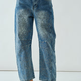 Front flat view of the Floral Embroidered Barrel Leg Jeans in medium wash