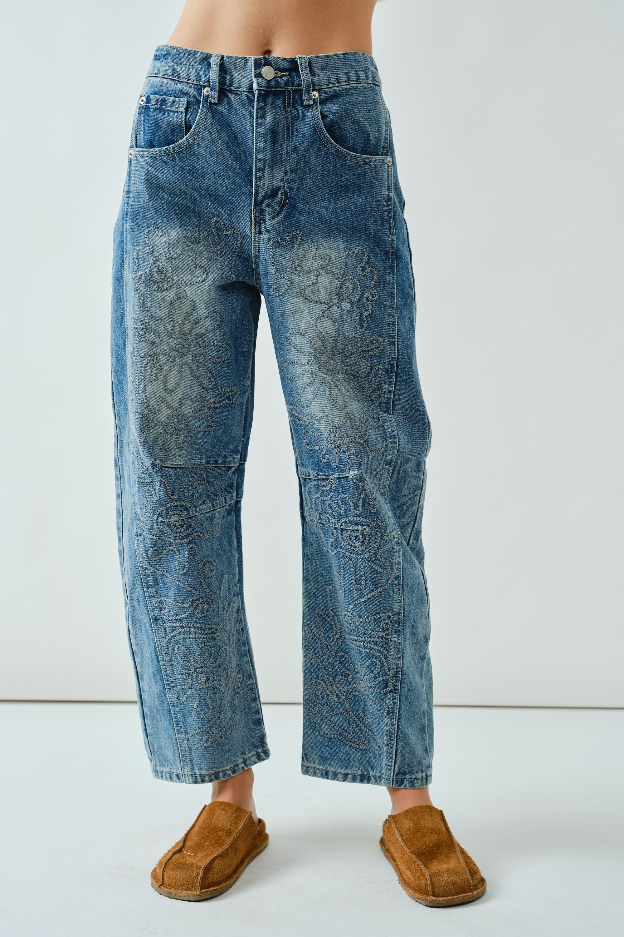 Front flat view of the Floral Embroidered Barrel Leg Jeans in medium wash