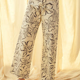 Floral print wide leg denim pants in charcoal with high-rise waist and stretch cotton fabric