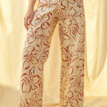 Floral print wide leg denim pants in red with high-rise waist and stretch cotton fabric
