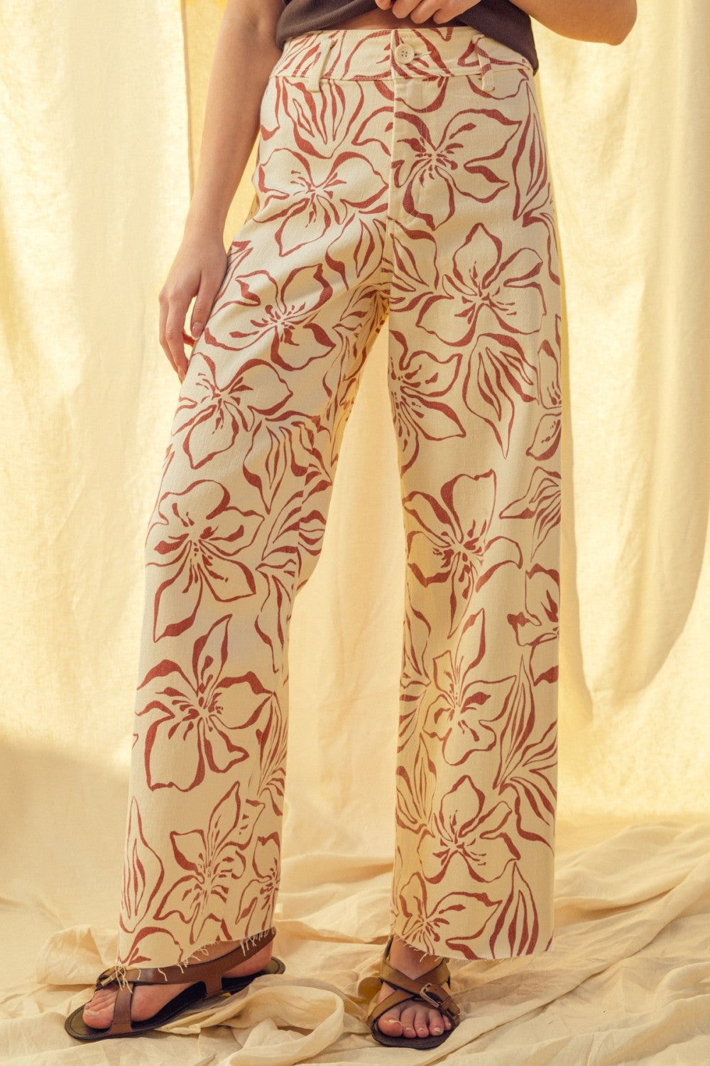 Floral print wide leg denim pants in red with high-rise waist and stretch cotton fabric