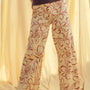 Woman wearing red floral print wide leg denim pants styled with casual outfit