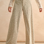 Floral wide leg corduroy pants in tan and olive with high-rise waist and relaxed silhouette