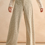 Floral wide leg corduroy pants in tan and olive with high-rise waist and relaxed silhouette
