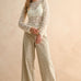 Woman wearing tan and olive floral wide leg corduroy pants styled with casual outfit