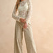 Woman wearing tan and olive floral wide leg corduroy pants styled with casual outfit
