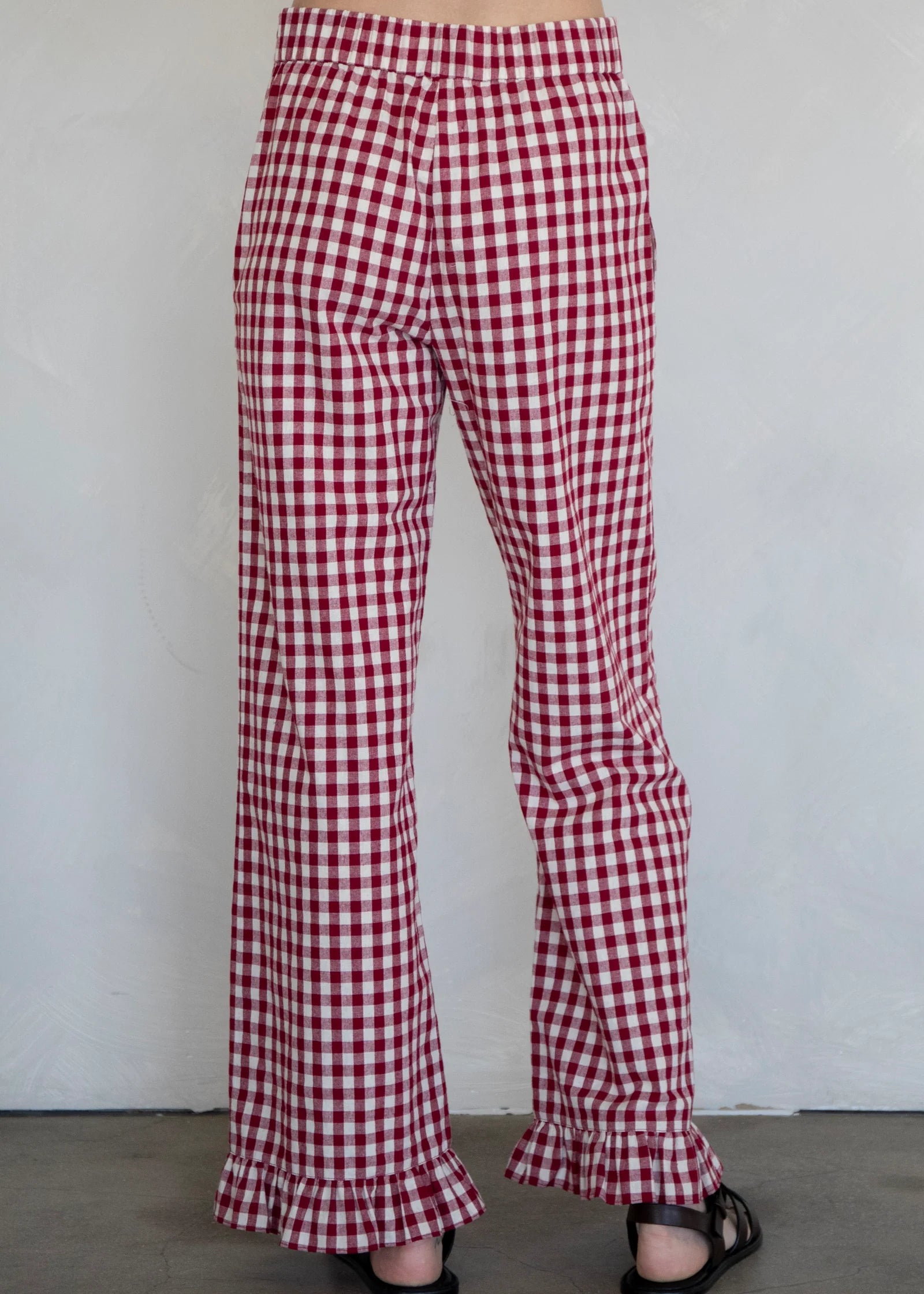 Back view of burgundy gingham cotton pants with relaxed silhouette