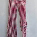 Front view of burgundy gingham cotton pants with elastic waistband