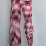 Front view of burgundy gingham cotton pants with elastic waistband