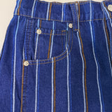 Close-up detail of Good Luck Barrel Jeans showing navy denim, brushed white and brown stripes, pockets, and button closure.