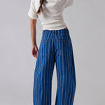 Studio back view of Good Luck Barrel Jeans showing the elastic back waistband, striped denim, and relaxed barrel silhouette.