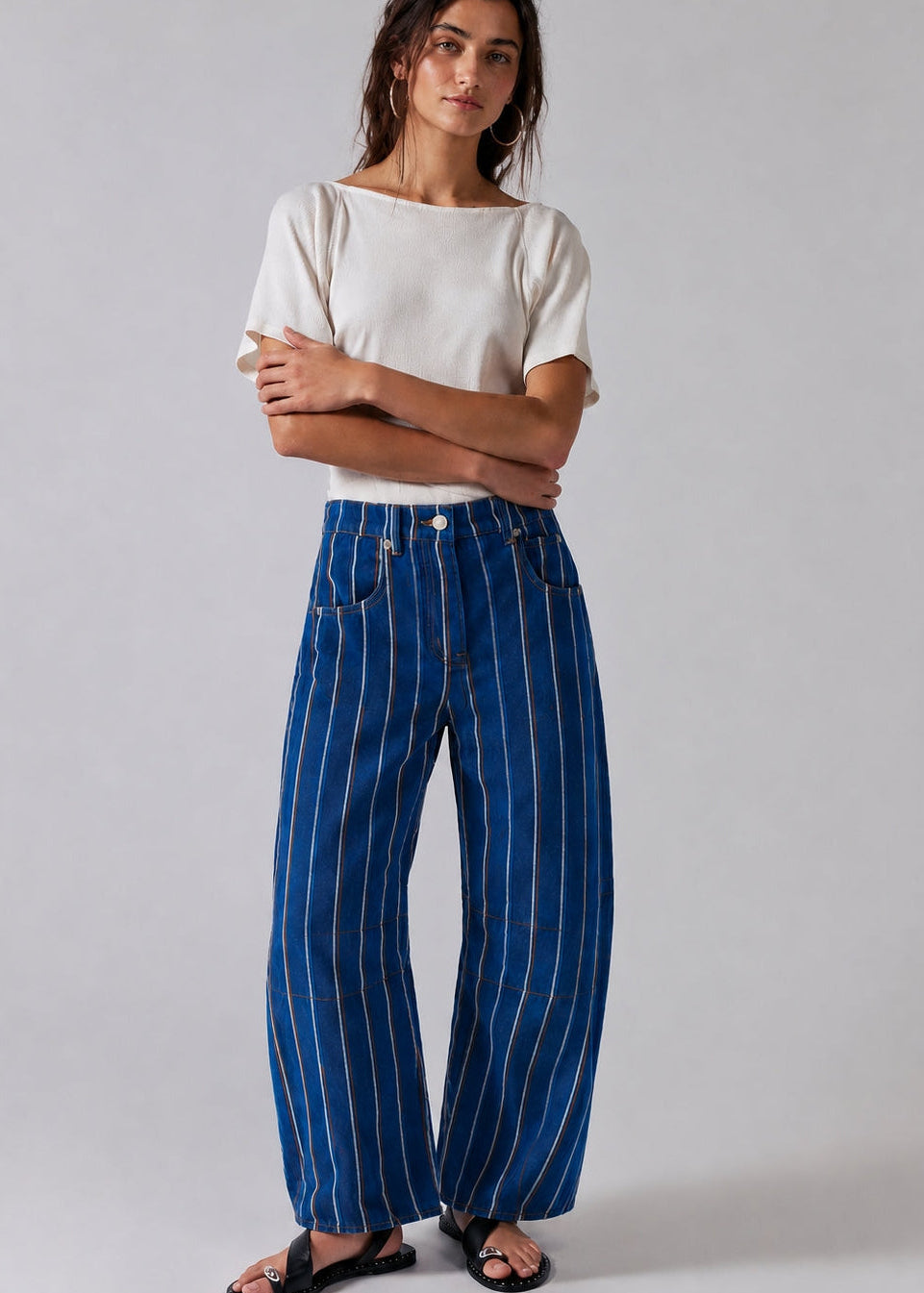 Studio front view of Good Luck Barrel Jeans in navy denim with white and brown vertical stripes and relaxed barrel-leg fit.