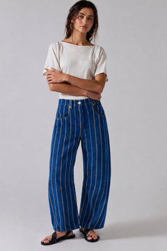 Studio front view of Good Luck Barrel Jeans in navy denim with white and brown vertical stripes and relaxed barrel-leg fit.