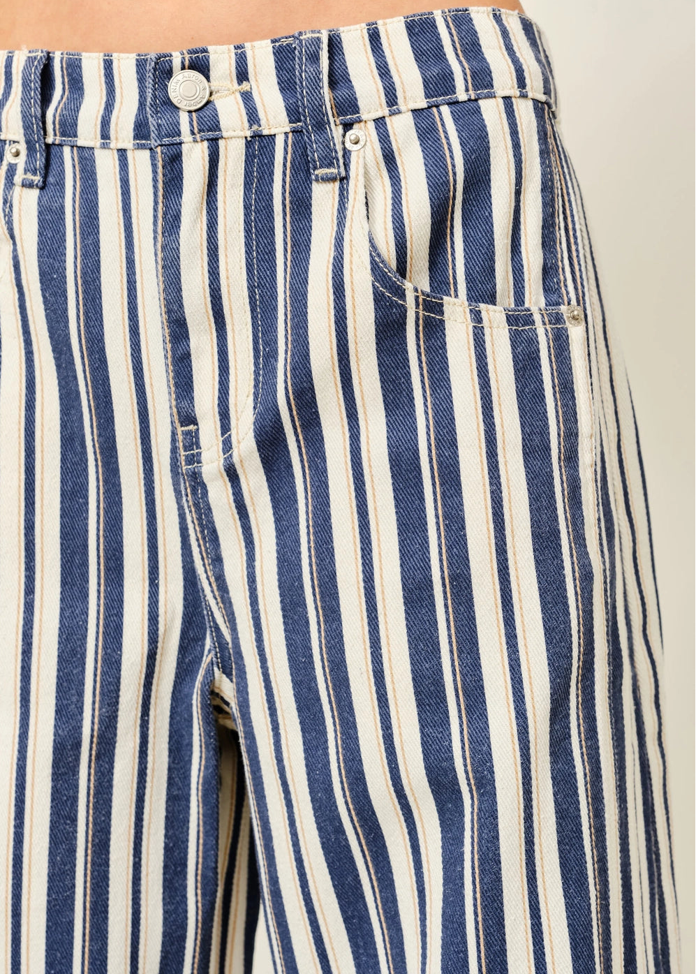 Close-up of Good Luck Barrel Jeans in Navy Stripe showing the striped cotton fabric and front details
