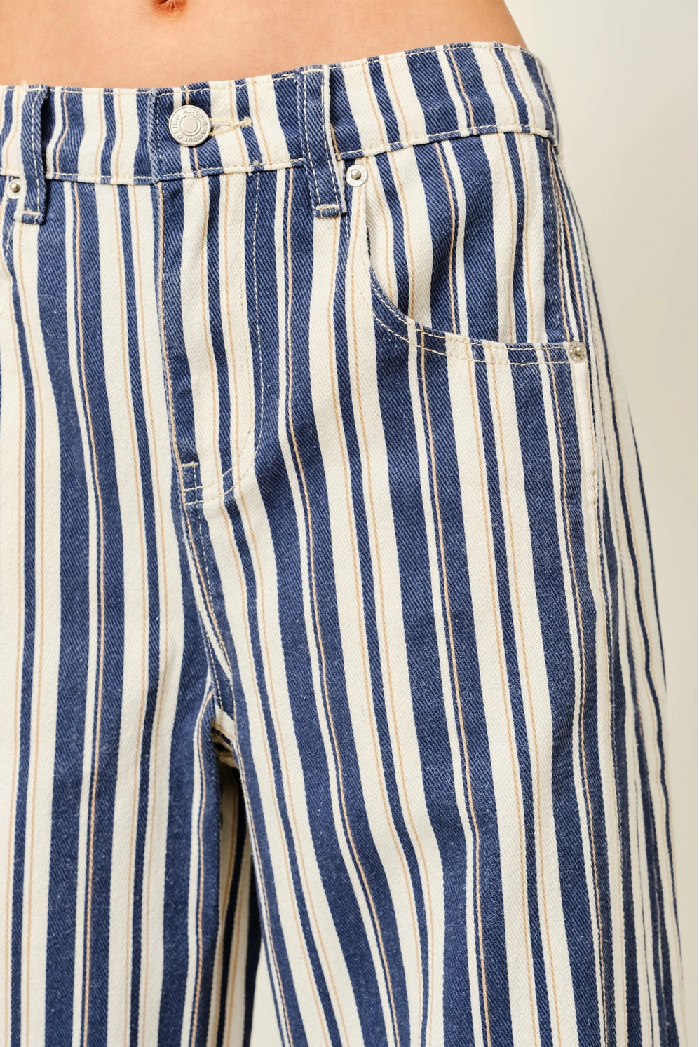 Close-up of Good Luck Barrel Jeans in Navy Stripe showing the striped cotton fabric and front details