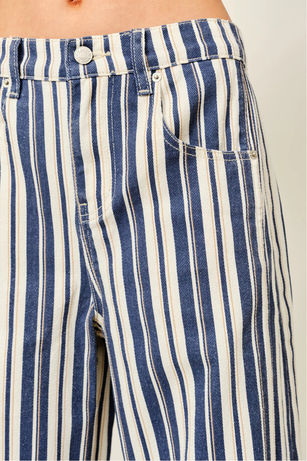 Close-up of Good Luck Barrel Jeans in Navy Stripe showing the striped cotton fabric and front details