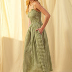 Side view of green gingham cotton maxi dress with smocked bodice