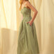 Side view of green gingham cotton maxi dress with smocked bodice