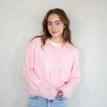 model is wearing Hailey button down cardigan in baby pink - Angled front view 