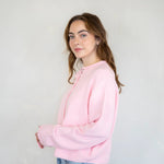 Side view of Hailey cardigan in baby pink showing relaxed fit