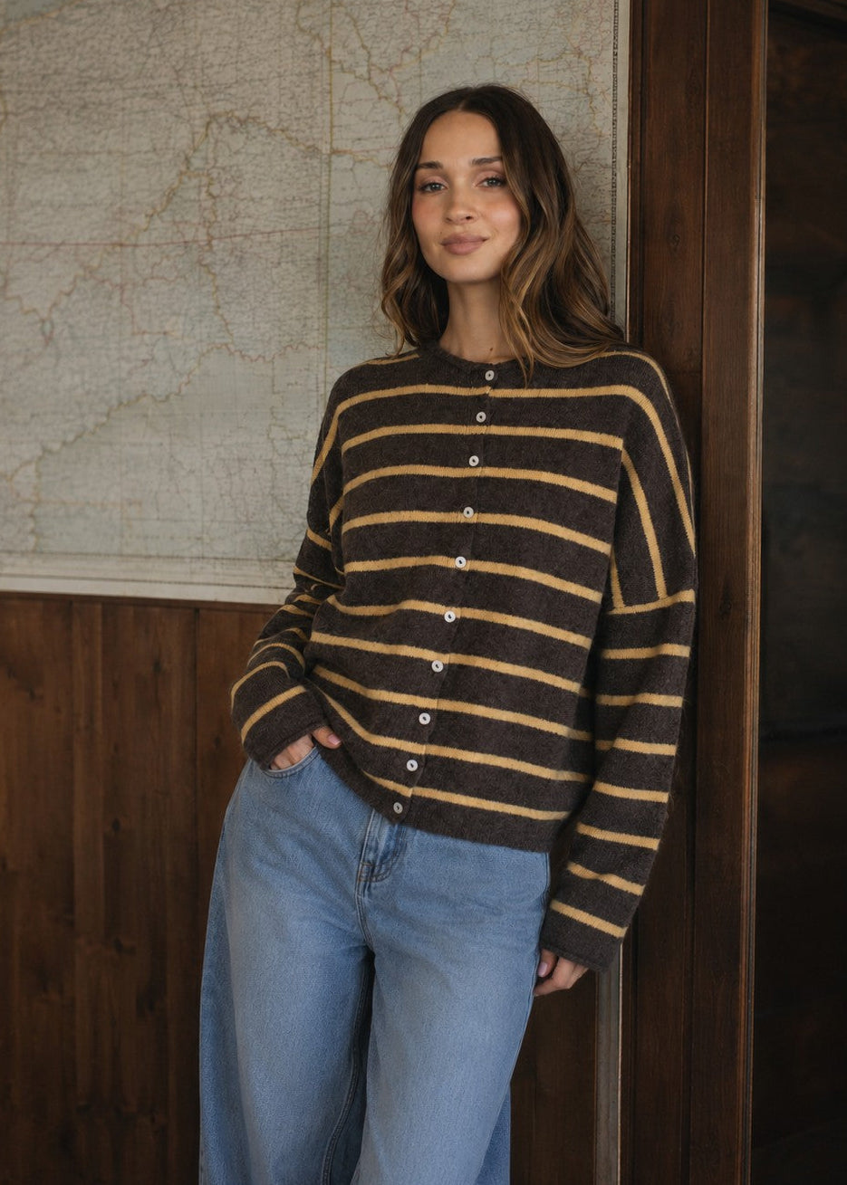 Model wearing the Things Between Piper Cardigan Cabana Stripe Brown Orange, front lifestyle view