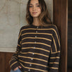 Model wearing the Hailey Button Down Cardigan in Cabana Stripe Brown-Orange, front lifestyle view