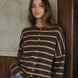 Model wearing the Hailey Button Down Cardigan in Cabana Stripe Brown-Orange, front lifestyle view