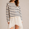 Model wearing the Things Between Piper Cardigan Cabana Stripe Natural Navy  in a relaxed standing outfit