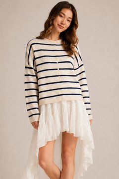 Model wearing the Things Between Piper Cardigan Cabana Stripe Natural Navy  in a relaxed standing outfit