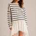 Model wearing the Things Between Piper Cardigan Cabana Stripe Natural Navy  in a relaxed standing outfit