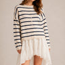 Model wearing the Things Between Piper Cardigan Cabana Stripe Natural Navy  in a relaxed standing outfit