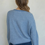 Back view of the Hailey Button Down Cardigan in a Dusty Blue pin-striped knit.