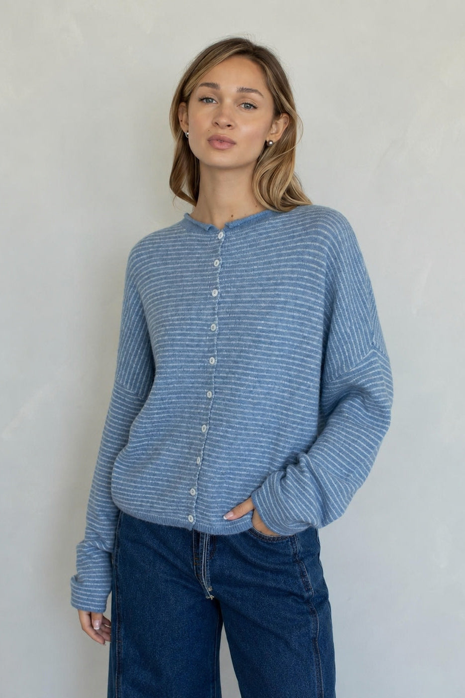 Front view of the Hailey Button Down Cardigan in Dusty Blue with fine ivory pinstripes.
