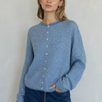 Front view of the Hailey Button Down Cardigan in Dusty Blue with fine ivory pinstripes.