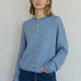 Front view of the Hailey Button Down Cardigan in Dusty Blue with fine ivory pinstripes.