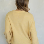 Back view of the Hailey Button Down Cardigan (Piper Cardigan) in honey showing relaxed fit