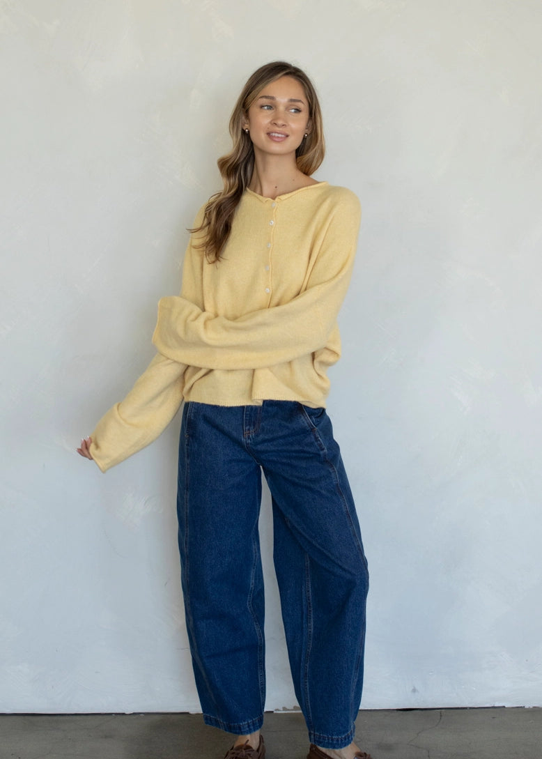 Full-body view of the Hailey Button Down Cardigan (Piper Cardigan) in honey styled with jeans