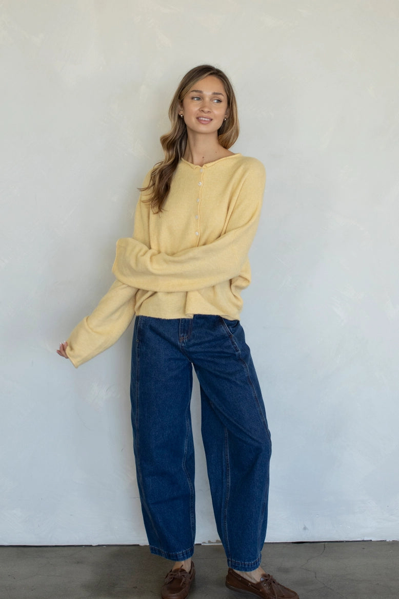 Full-body view of the Hailey Button Down Cardigan (Piper Cardigan) in honey styled with jeans