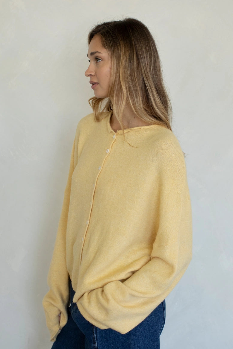 Side view of the Hailey Button Down Cardigan (Piper Cardigan) in honey highlighting drape and silhouette