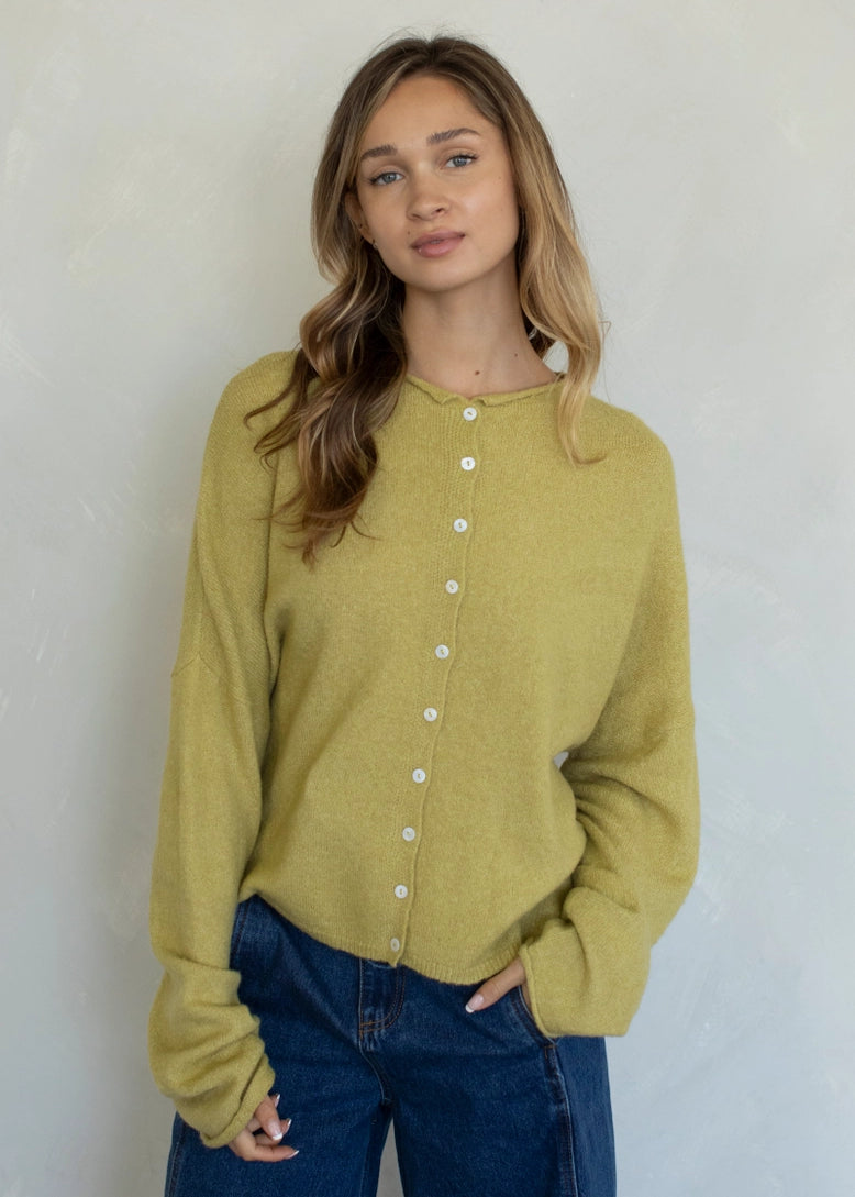 Front portrait of model wearing the Hailey Button Down Cardigan (Piper Cardigan) in moss